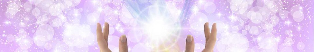 Orbs and sparkles of healing light on a purple background.