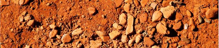 Brown, rocky soil depicting the earth element of the Gaia Ray of Healing
